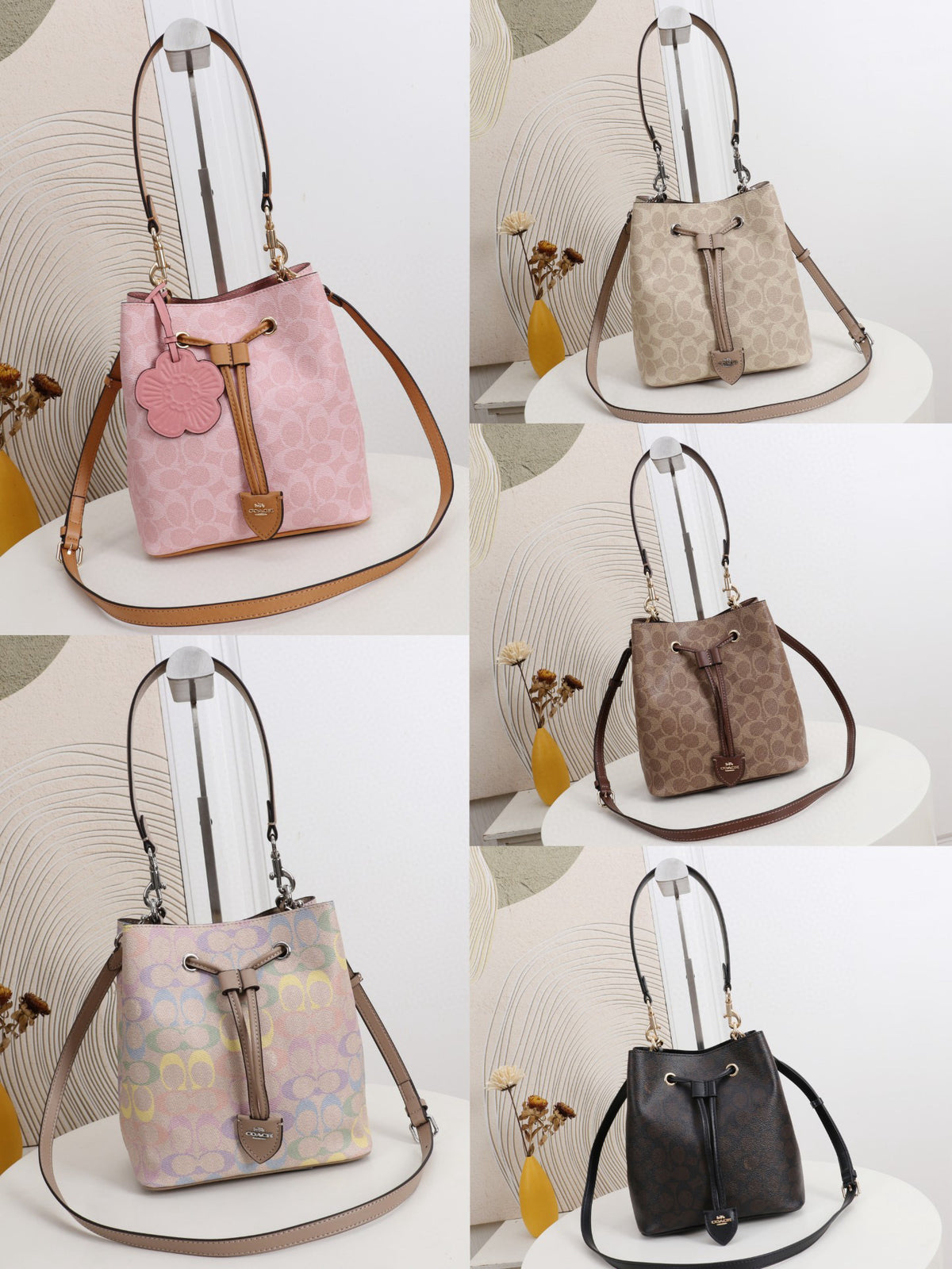 A six-panel collage showing five bucket-style shoulder bags in different colors, each displayed on a white stand against a light neutral background with decorative dried flowers. The bags include pink, beige, taupe-brown, pastel lavender, and dark brown/black, with drawstring tops, long straps, and small hanging charms.