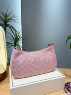 Embossed Monogram Curved Shoulder Bag – Elegant Canvas Crescent Bag