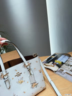 The Floral Printed Leather Bucket Tote & Crossbody