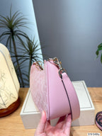 Embossed Monogram Curved Shoulder Bag – Elegant Canvas Crescent Bag