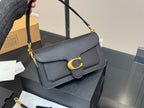 Black Shoulder Bag with Gold-Tone Hardware and Adjustable Strap
