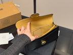 Black Shoulder Bag with Gold-Tone Hardware and Adjustable Strap