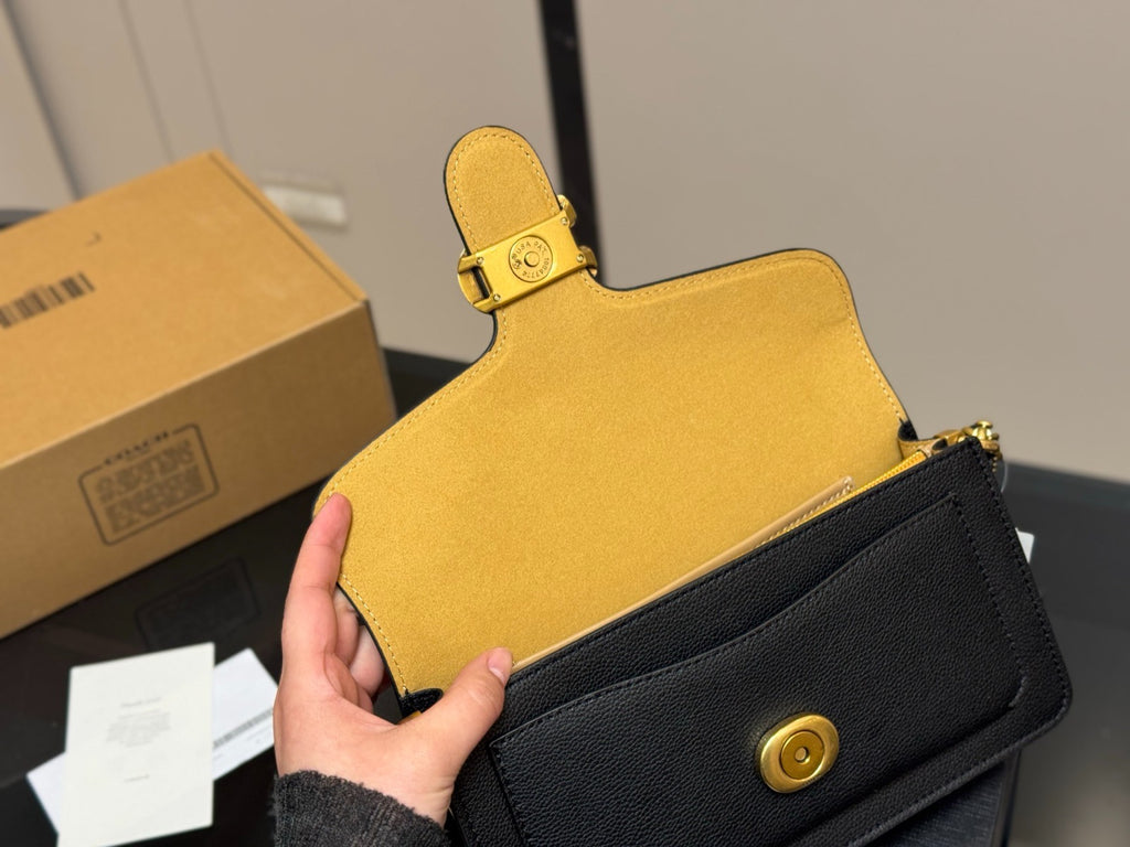 Black Shoulder Bag with Gold-Tone Hardware and Adjustable Strap