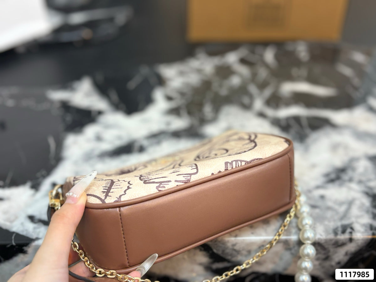 Seashell Monogram Pearl Chain Wristlet Pochette